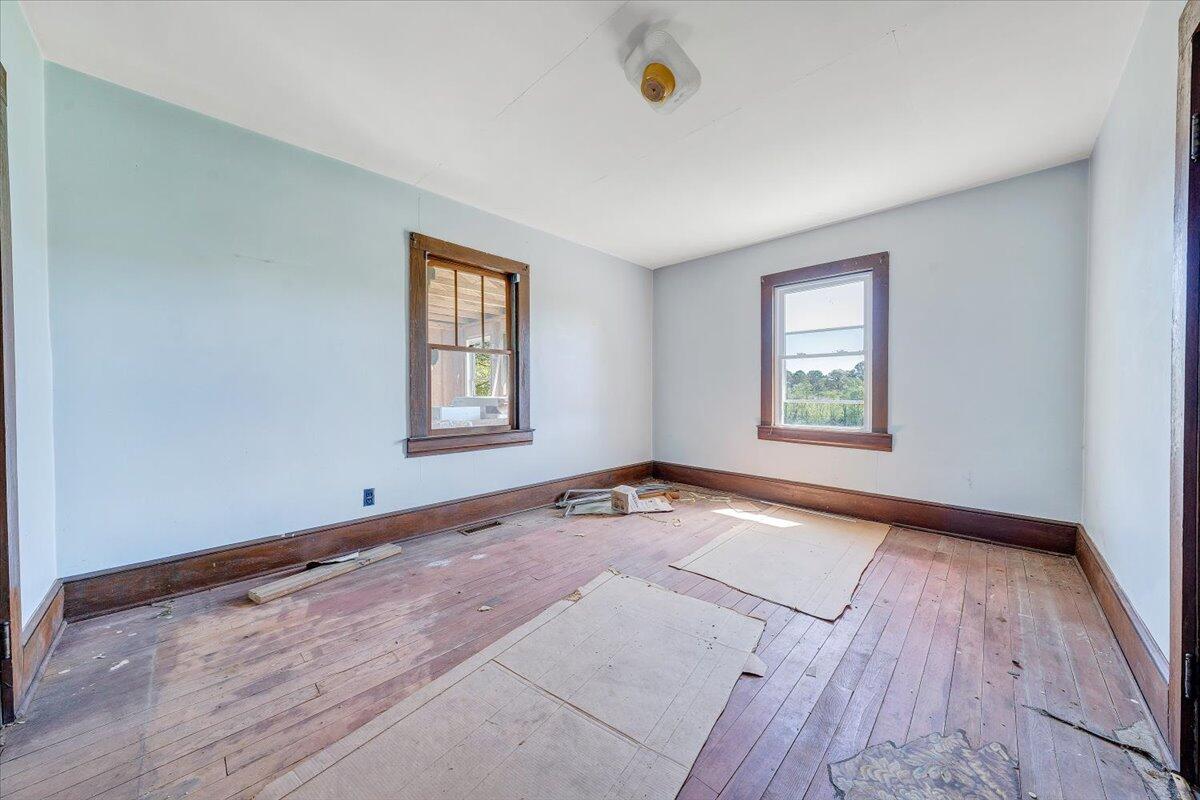 15723 Moneta Road Moneta, VA 24121 - Photo 31 of 38 an empty room with wooden floor and windows