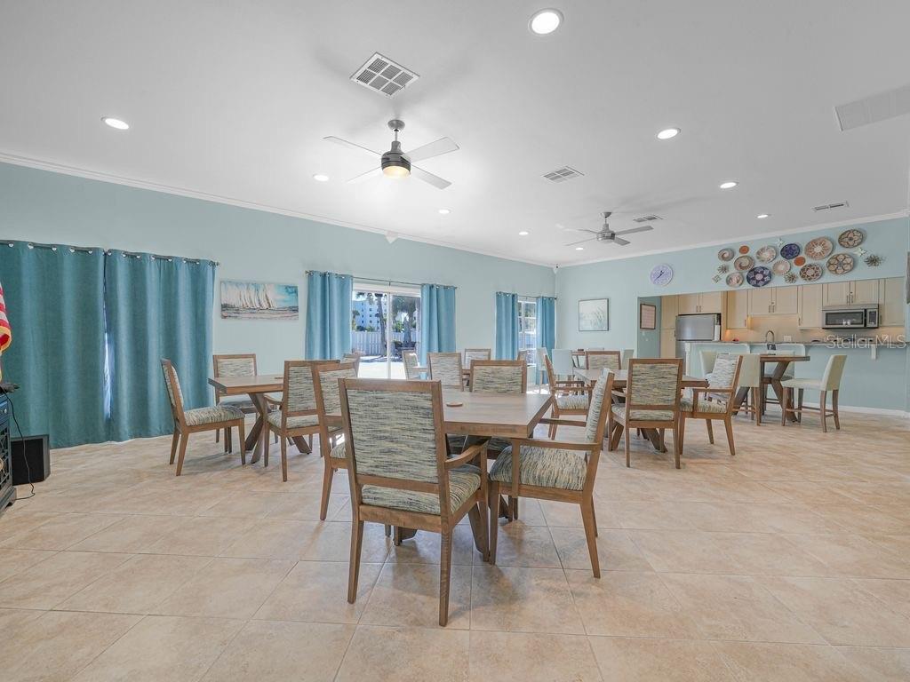 549 Sutton Place, Unit T 19 Longboat Key, FL 34228 - Photo 37 of 52 a view of a dining room with furniture