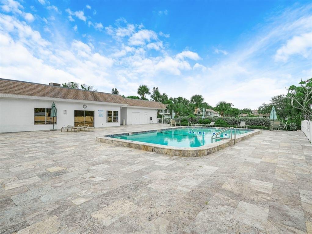 549 Sutton Place, Unit T 19 Longboat Key, FL 34228 - Photo 48 of 52 a view of a house with a big yard