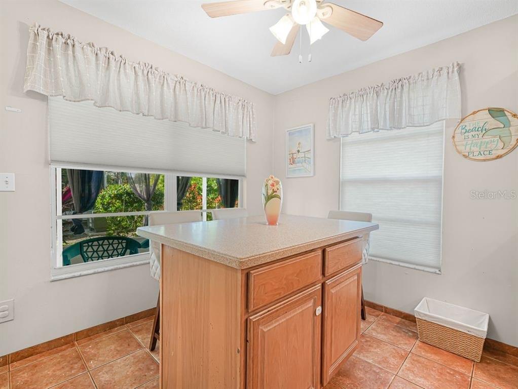 549 Sutton Place, Unit T 19 Longboat Key, FL 34228 - Photo 8 of 52 a kitchen that has a cabinets and a window