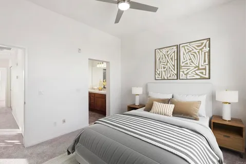a bathroom with a granite countertop sink a large mirror and a shower