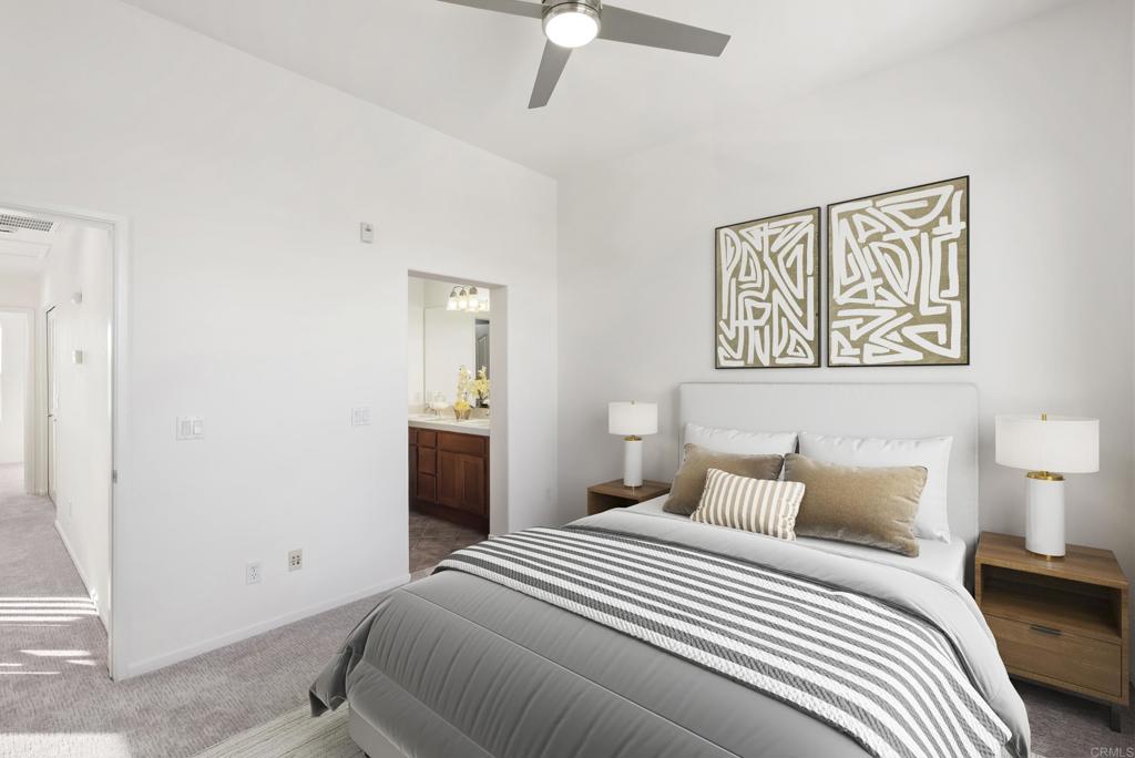 1276 San Elijo Road North San Marcos, CA 92078 - Photo 11 of 35 a bedroom with a bed and a lamp on the dresser