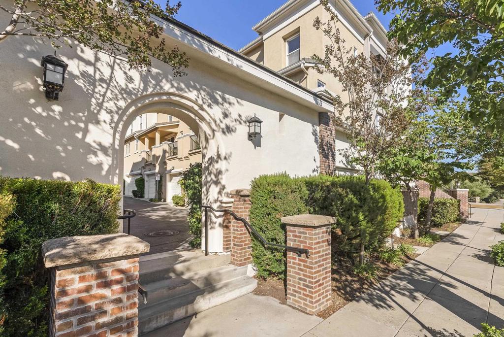 1276 San Elijo Road North San Marcos, CA 92078 - Photo 2 of 35 a front view of a house with a garden