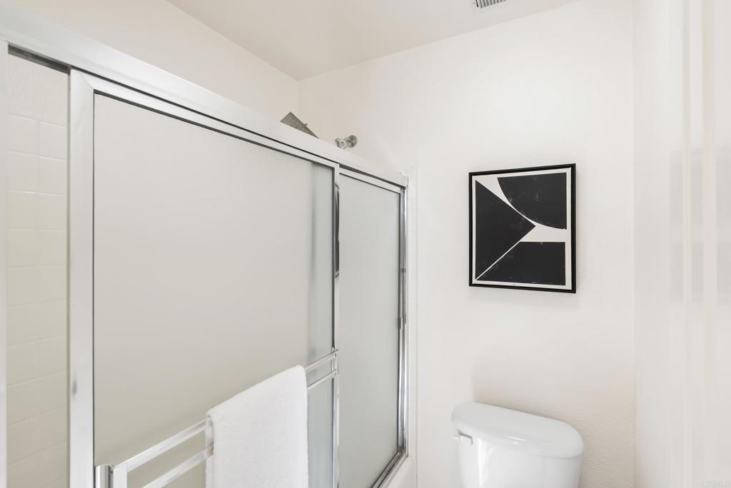 1276 San Elijo Road North San Marcos, CA 92078 - Photo 23 of 35 a bathroom with a toilet and a shower