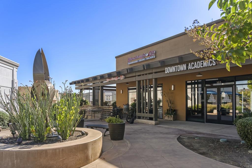 1276 San Elijo Road North San Marcos, CA 92078 - Photo 30 of 35 a front view of a building with potted plants