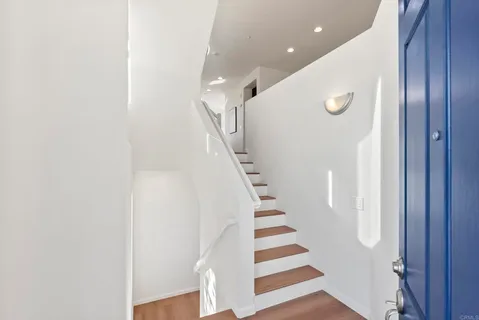 a view of entryway with wooden floor