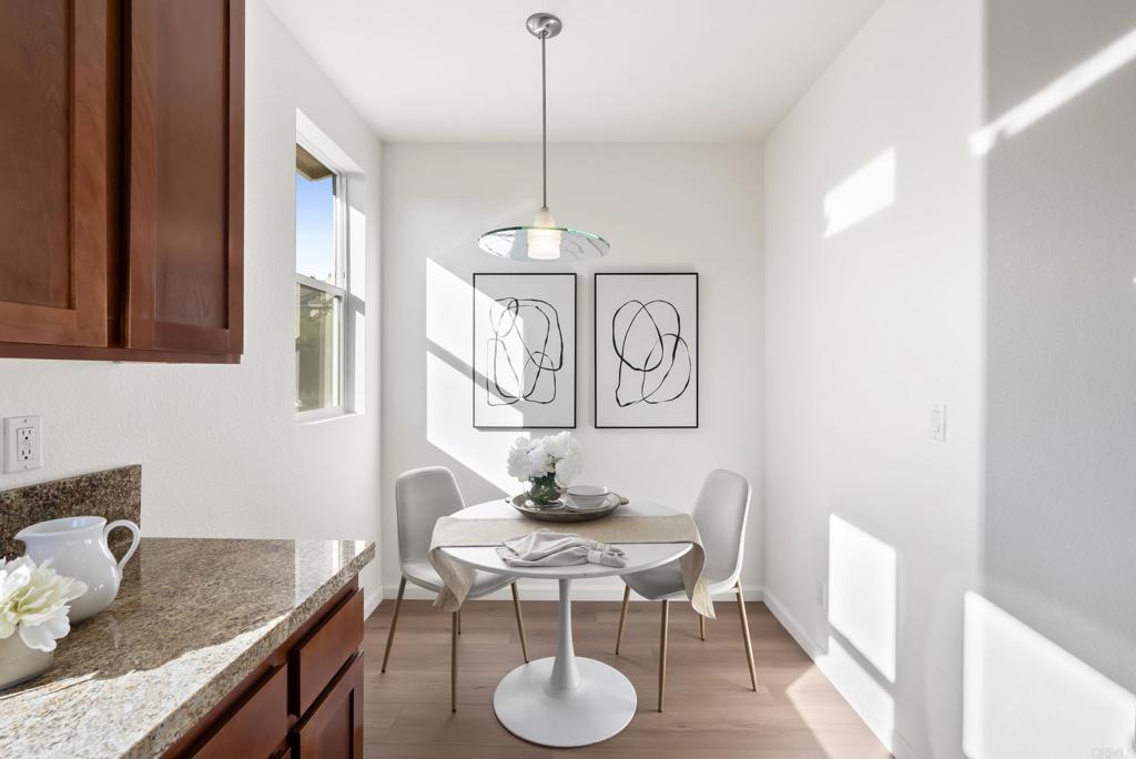 1276 San Elijo Road North San Marcos, CA 92078 - Photo 7 of 35 a view of a dining room with furniture window and wooden floor