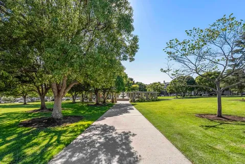 a backyard of a house with table and chairs