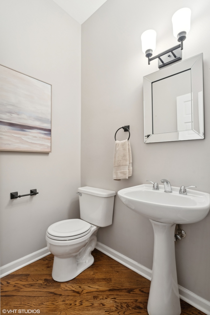 1372 North Dean Street, Unit 1 Chicago, IL 60622 - Photo 18 of 26 a bathroom with a toilet sink and mirror