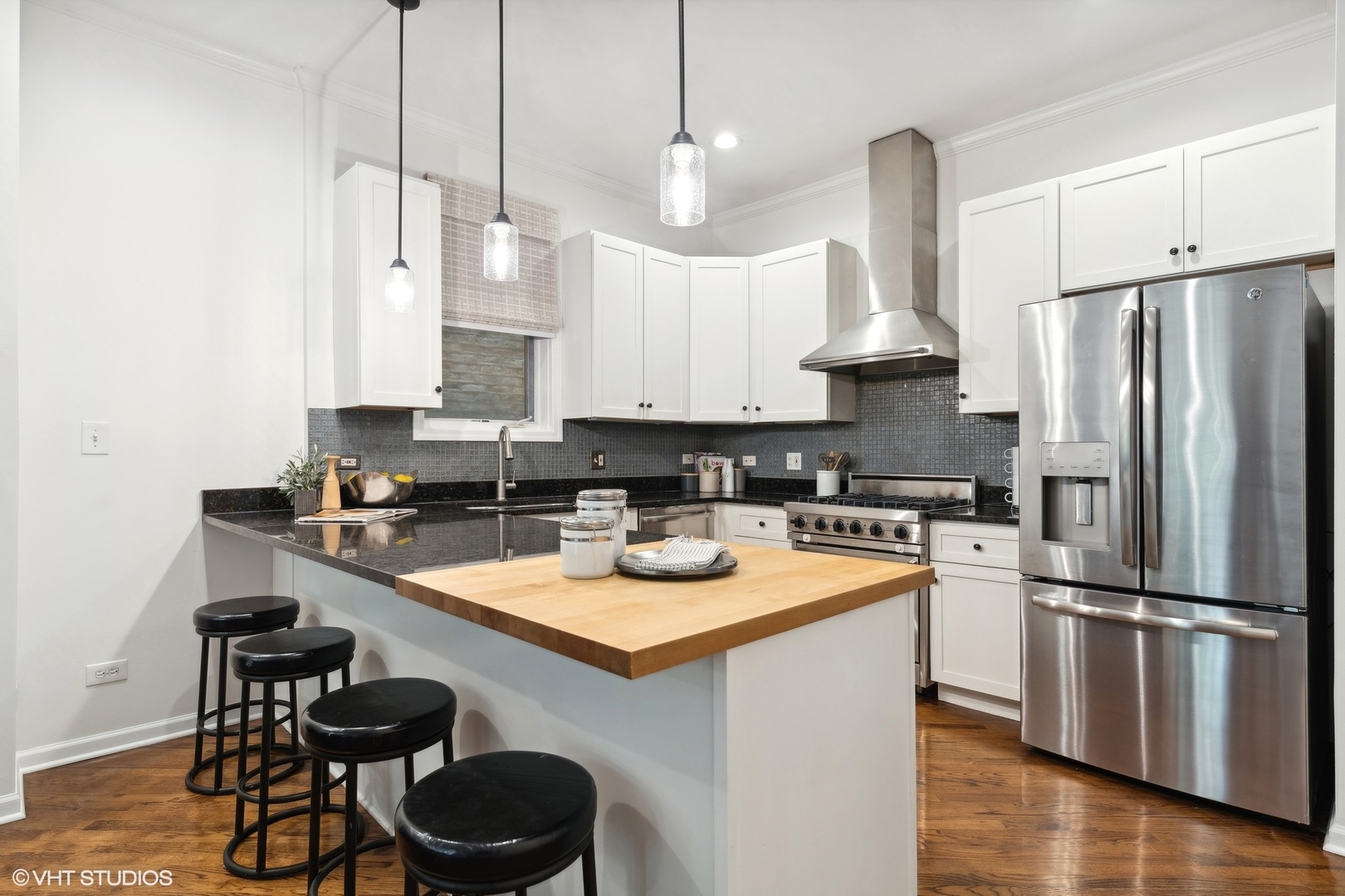1372 North Dean Street, Unit 1 Chicago, IL 60622 - Photo 5 of 26 a kitchen with stainless steel appliances granite countertop a sink a stove a refrigerator and island