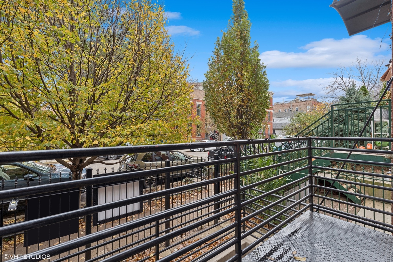 1372 North Dean Street, Unit 1 Chicago, IL 60622 - Photo 7 of 26 a view of a balcony with wooden fence and floor