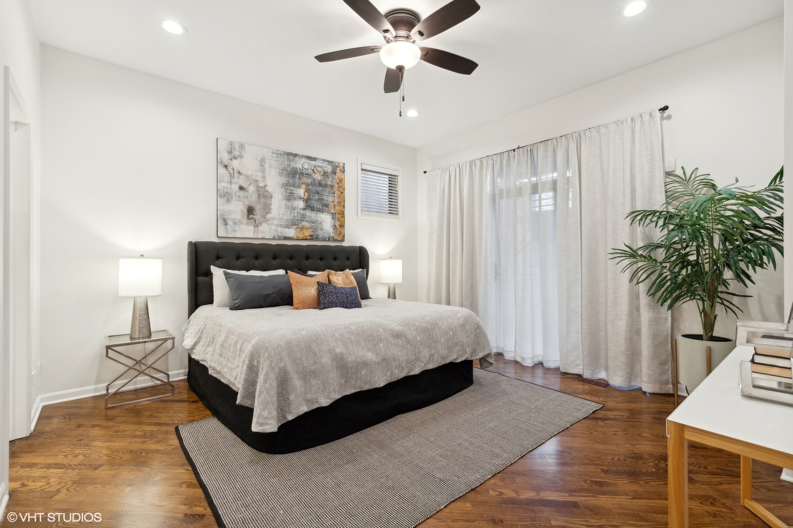 1372 North Dean Street, Unit 1 Chicago, IL 60622 - Photo 8 of 26 a bedroom with a large bed and a chandelier