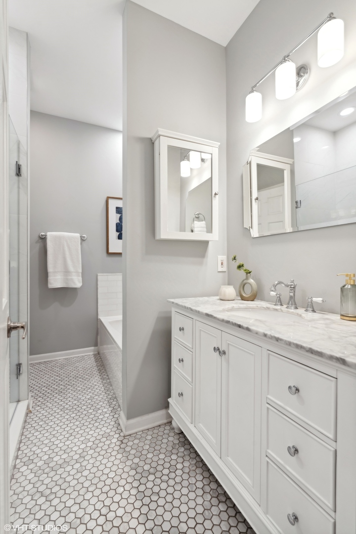 1372 North Dean Street, Unit 1 Chicago, IL 60622 - Photo 10 of 26 a bathroom with a sink a toilet and mirror