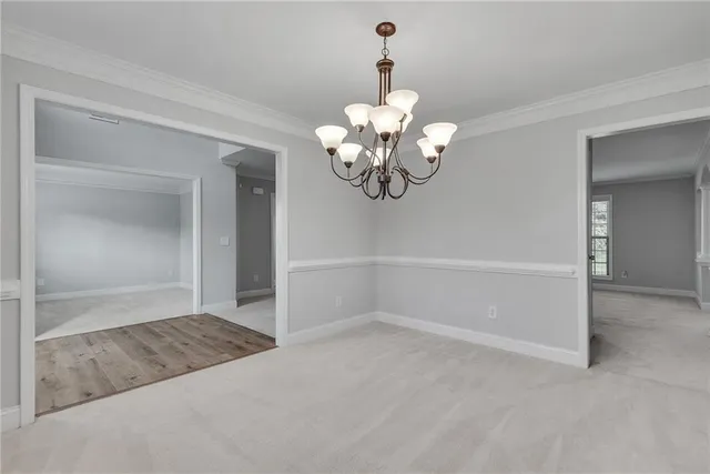 a view of staircase with white walls and a window