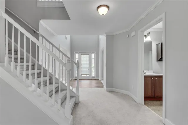 a bathroom with a sink a toilet a mirror and shower