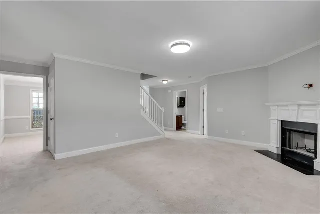 a large kitchen with a large kitchen island wooden floors wooden cabinets and stainless steel appliances