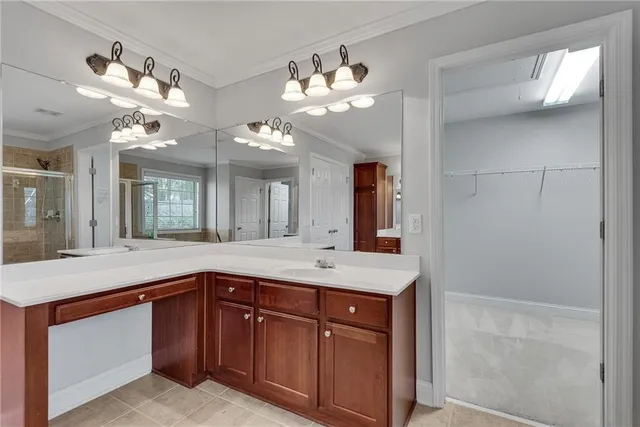 a view of storage and utility room with closet