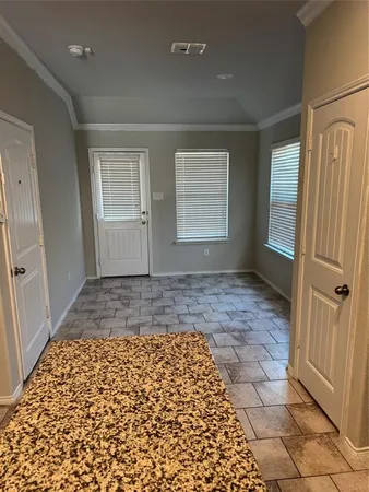a view of an empty room with a window