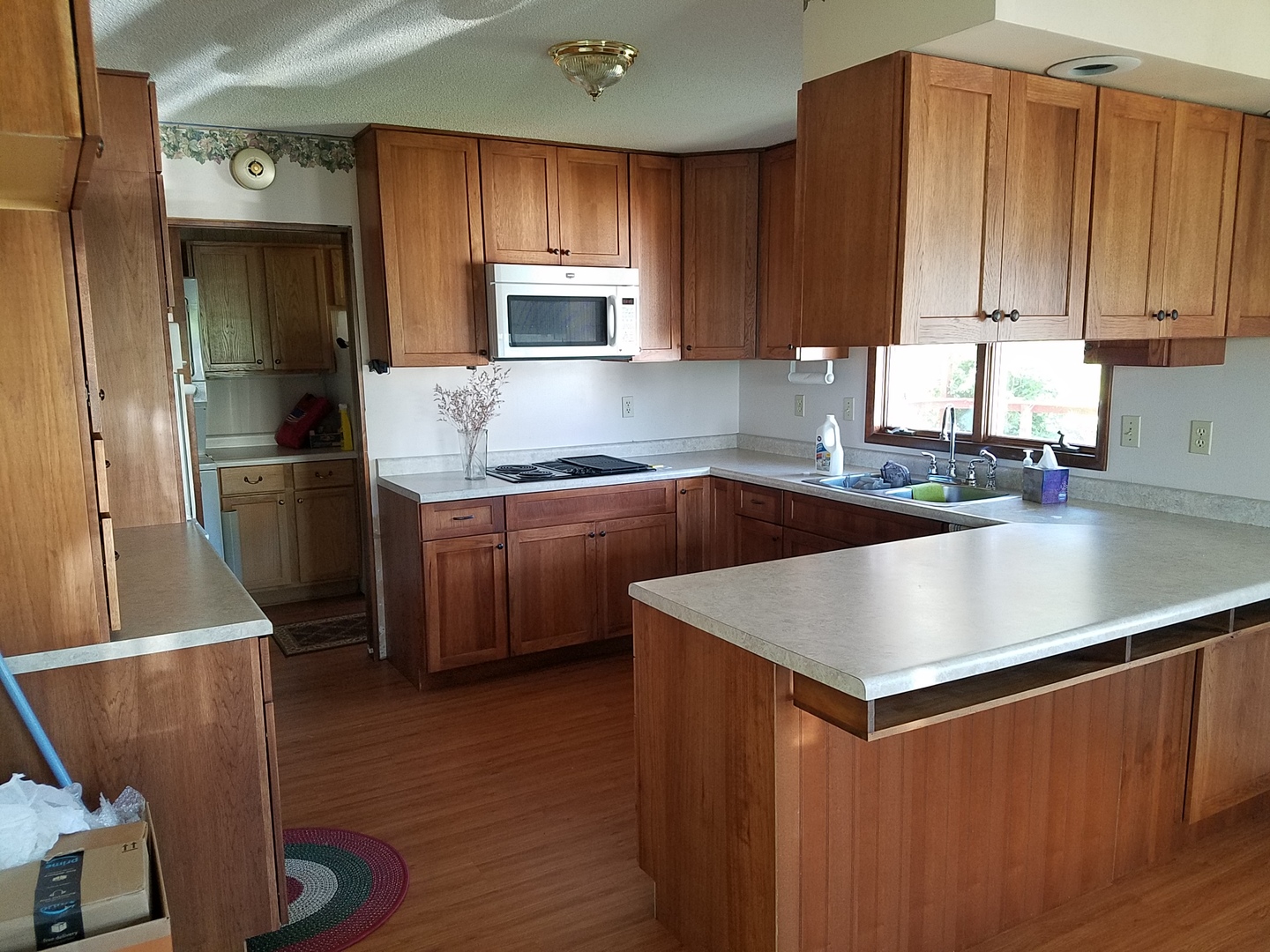10730 East Fowler Road Rochelle, IL 61068 - Photo 3 of 37 a kitchen with stainless steel appliances granite countertop a refrigerator a sink dishwasher a stove top oven a refrigerator with white cabinets and wooden floor