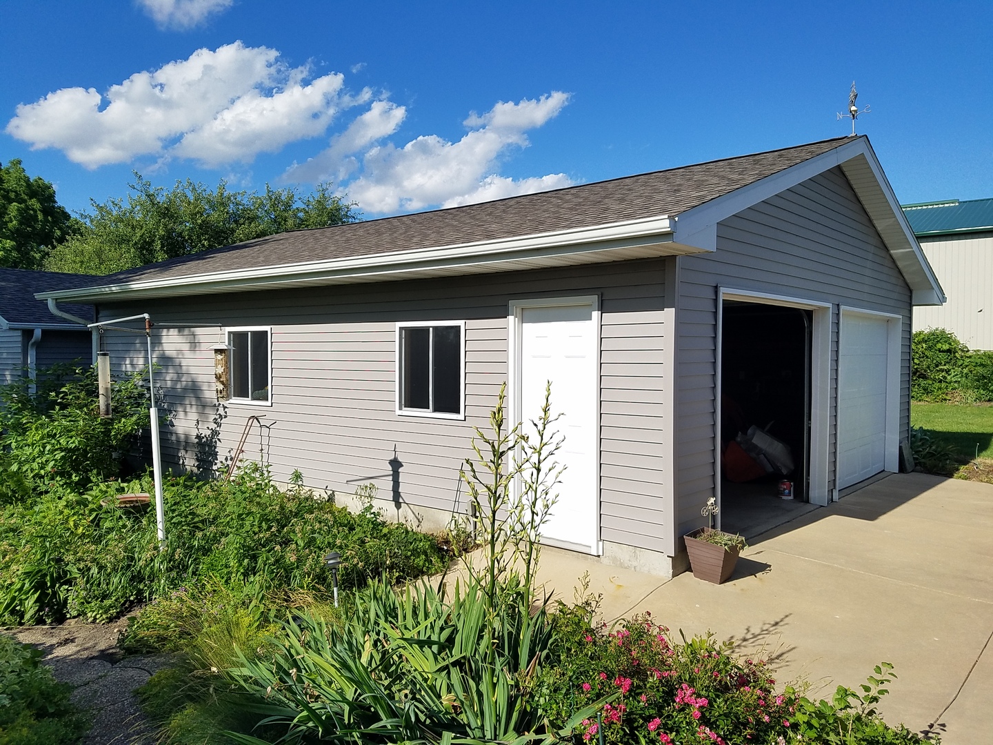 10730 East Fowler Road Rochelle, IL 61068 - Photo 25 of 37 front view of a house with a yard