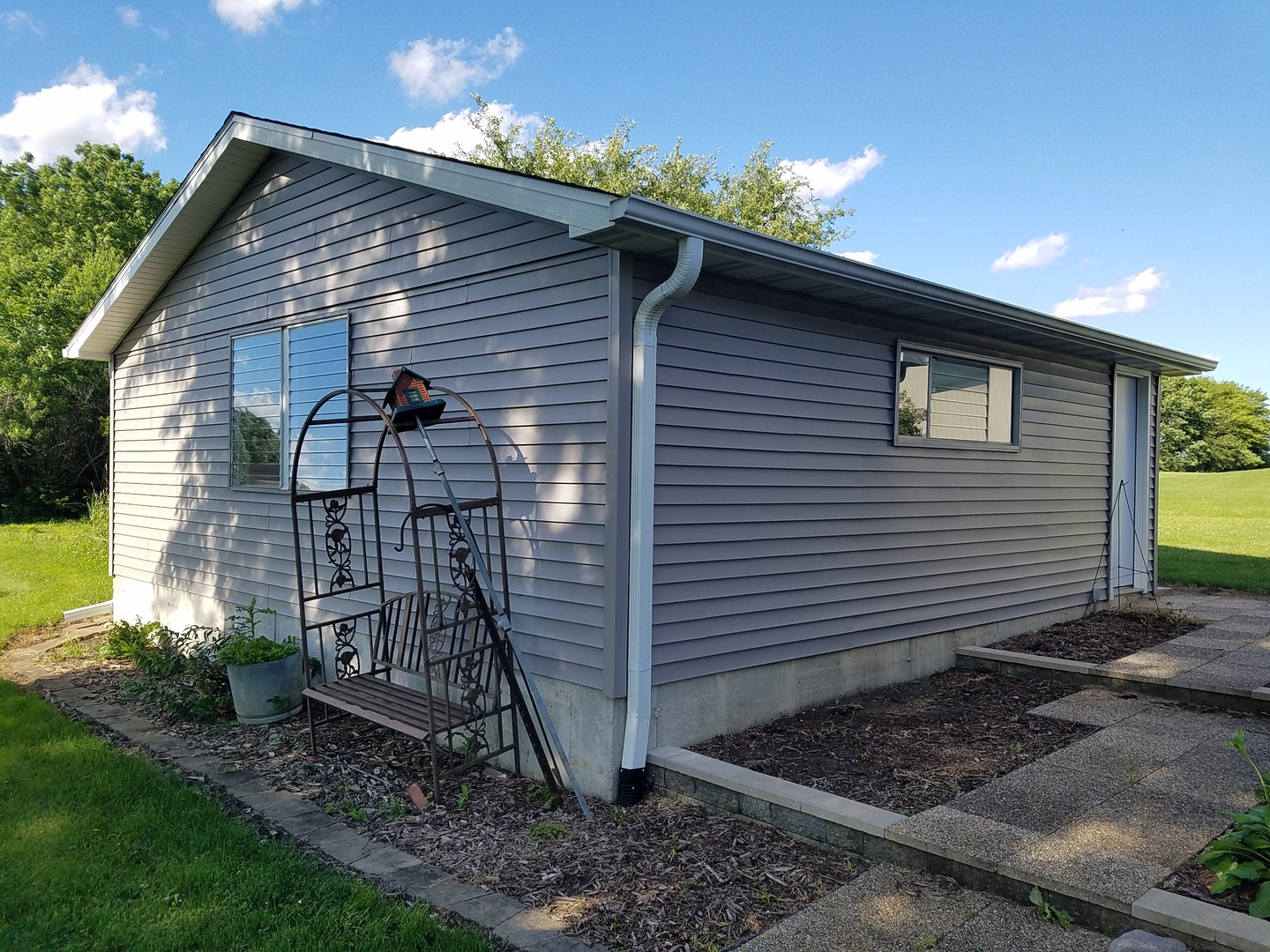 10730 East Fowler Road Rochelle, IL 61068 - Photo 27 of 37 a view of a house with a yard