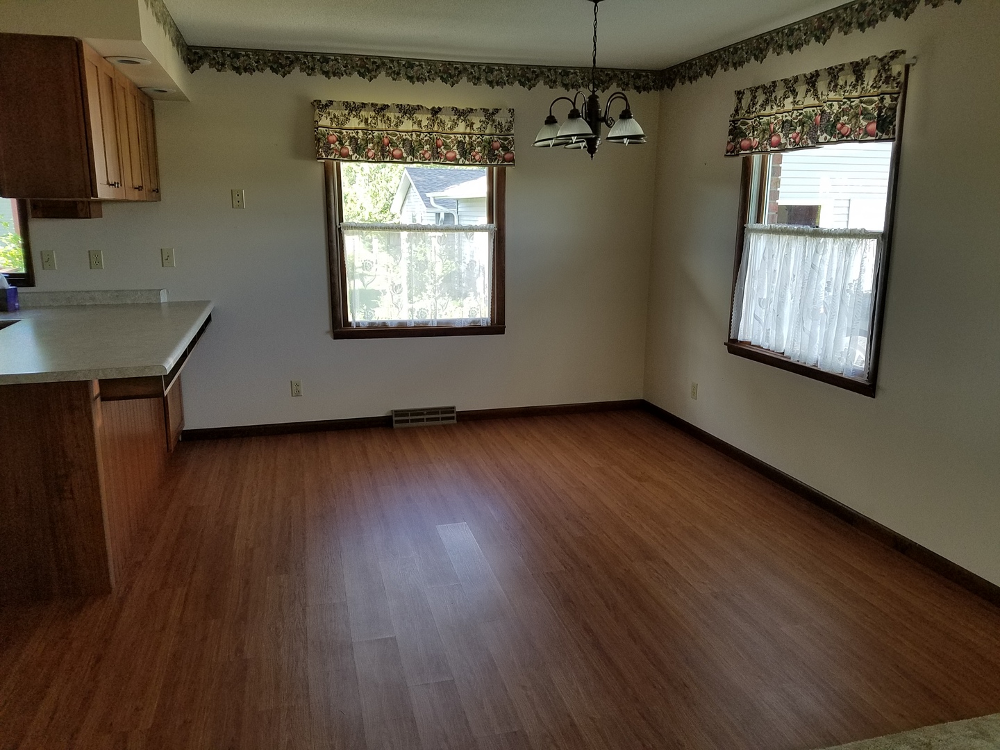 10730 East Fowler Road Rochelle, IL 61068 - Photo 4 of 37 a view of a room with wooden floor and a window