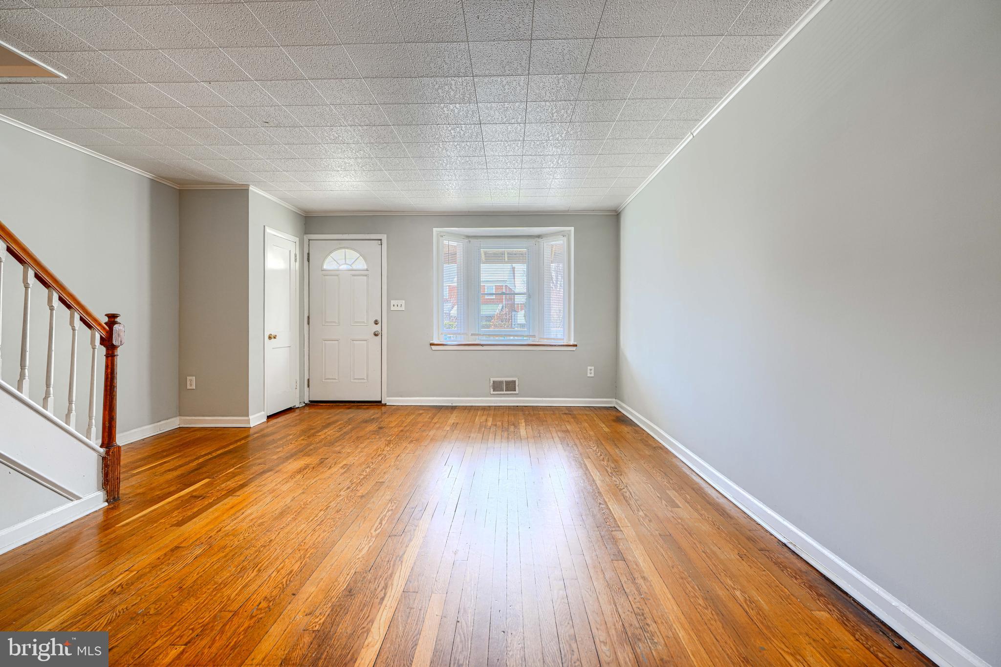 2073 Jasmine Road Baltimore, MD 21222 - Photo 5 of 29 a view of a room with wooden floor and window