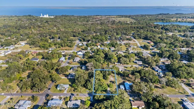 an aerial view of a residential houses and city view