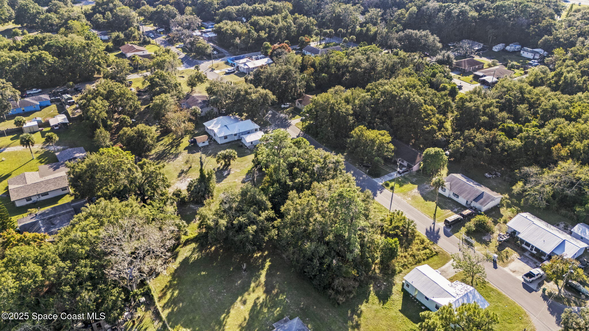 0 Unknown Avenue Mims, FL 32754 - Photo 4 of 9 an aerial view of residential houses with outdoor space