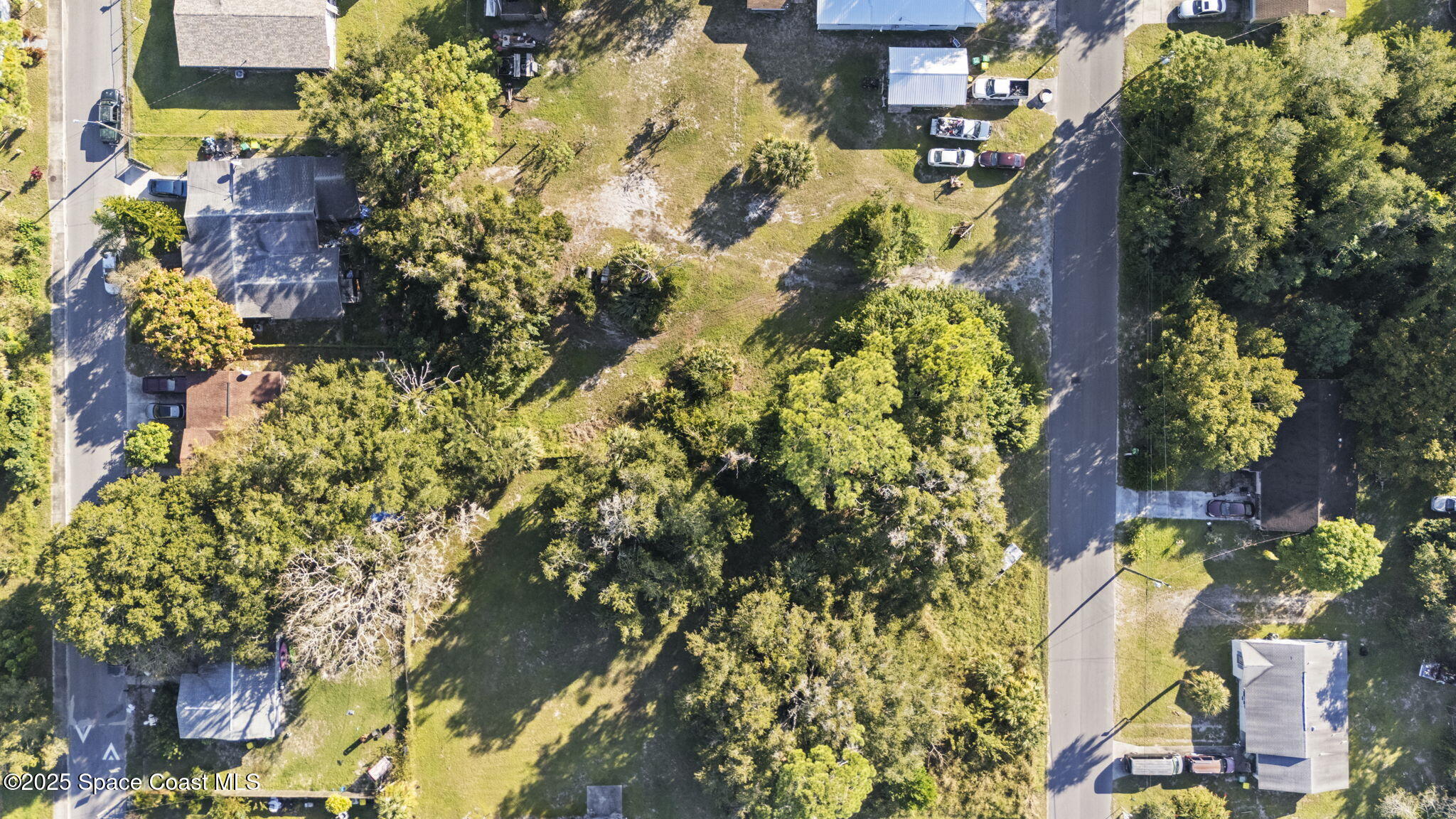 0 Unknown Avenue Mims, FL 32754 - Photo 8 of 9 an aerial view of residential houses with outdoor space
