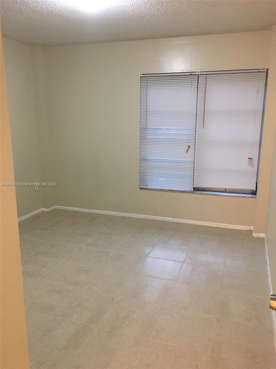4170 Inverrary Drive, Unit 111 Lauderhill, FL 33319 - Photo 19 of 28 an empty room with a empty space