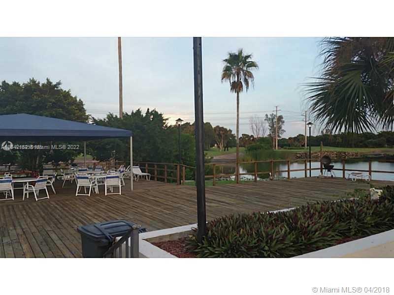 4170 Inverrary Drive, Unit 111 Lauderhill, FL 33319 - Photo 5 of 28 a view of a table and chairs in patio