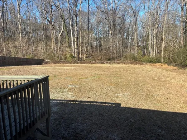 a view of a backyard of the house