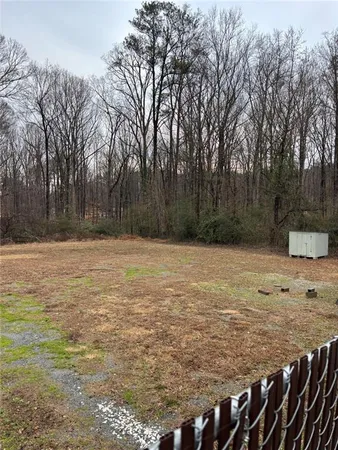 a view of a backyard of the house