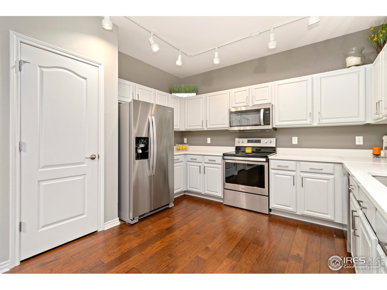 4672 West 20th Road, Unit 2123 Greeley, CO 80634 - Photo 8 of 25 Large pantry & stainless steel appliances