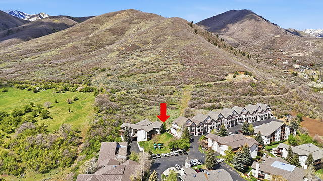 1041 West Grindelwald Court, Unit R5 Midway, UT 84049 - Photo 33 of 44 Aerial view of Swiss Oaks Midway condo community with buildings, trails, and surrounding mountain landscape