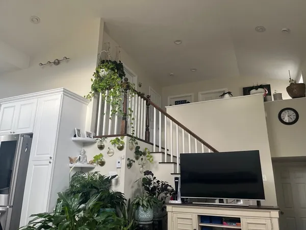 a view of a livingroom with furniture and a flat screen tv