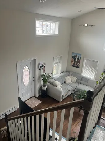 a bedroom with furniture and a chandelier