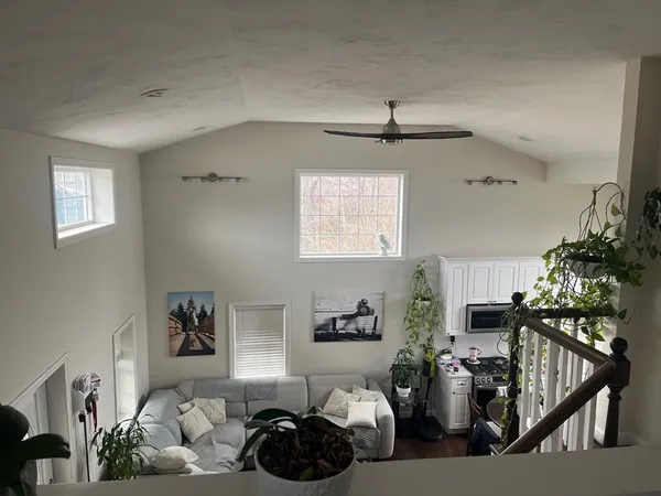 a bedroom with a bed and a television