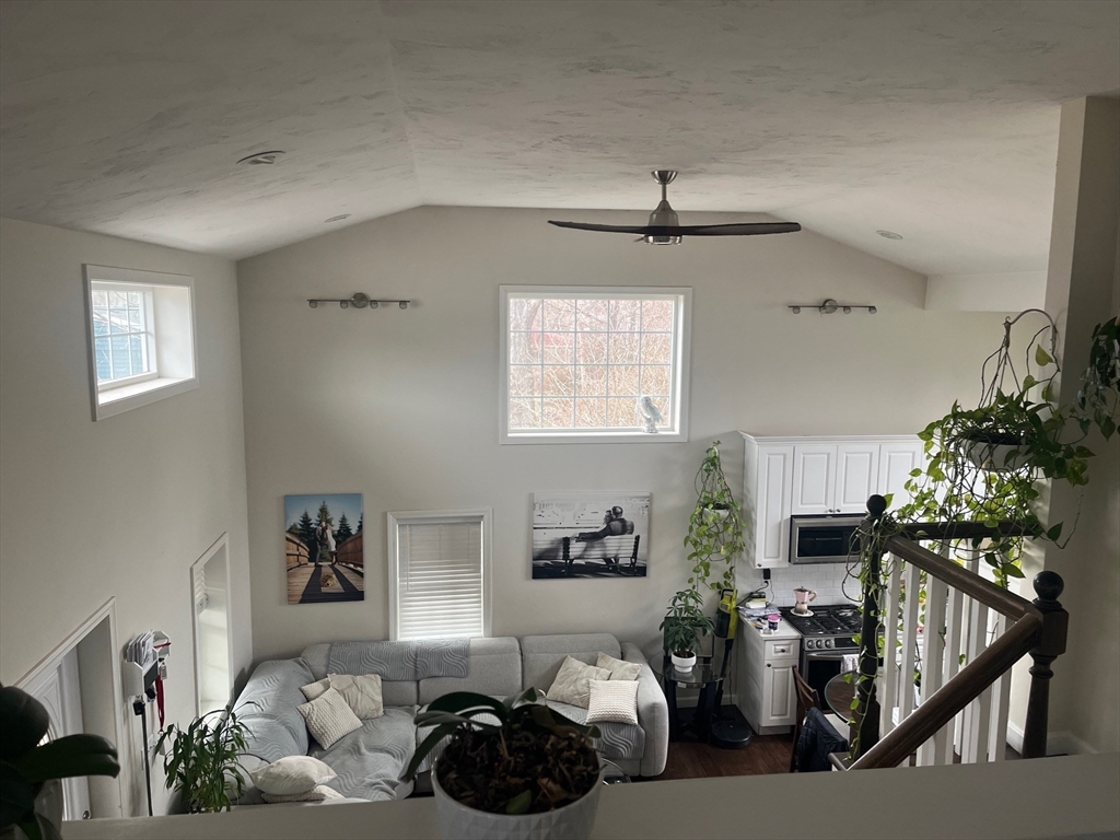 41 Jean Street Acushnet, MA 02743 - Photo 14 of 21 a bedroom with furniture and a chandelier