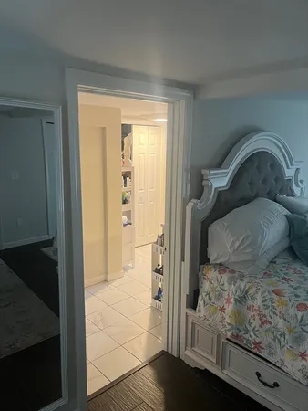 a bathroom with a tub a sink and a shower