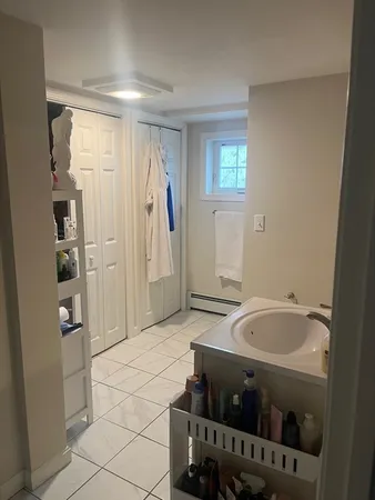 a white toilet sitting next to a bathroom sink