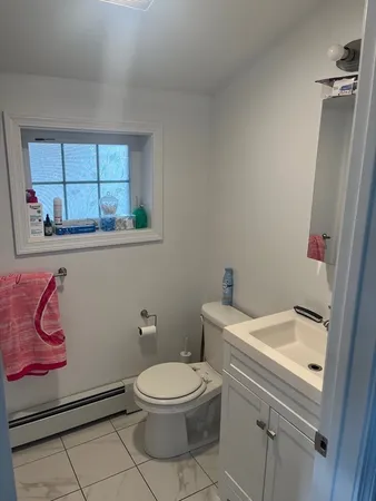 a view of a refrigerator in kitchen and window