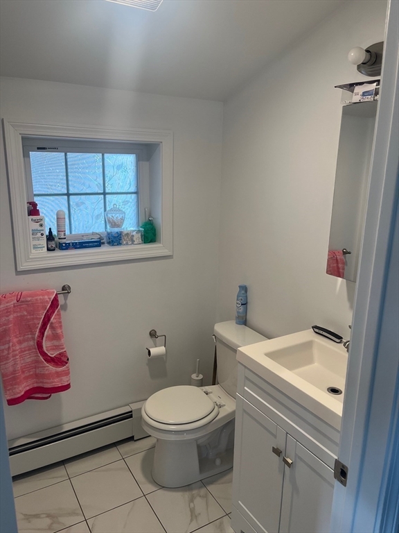41 Jean Street Acushnet, MA 02743 - Photo 18 of 21 a white toilet sitting next to a bathroom sink
