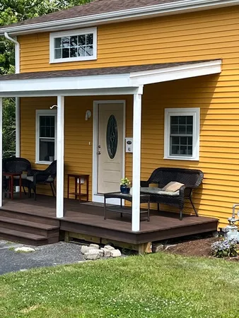 a front view of house with small garden
