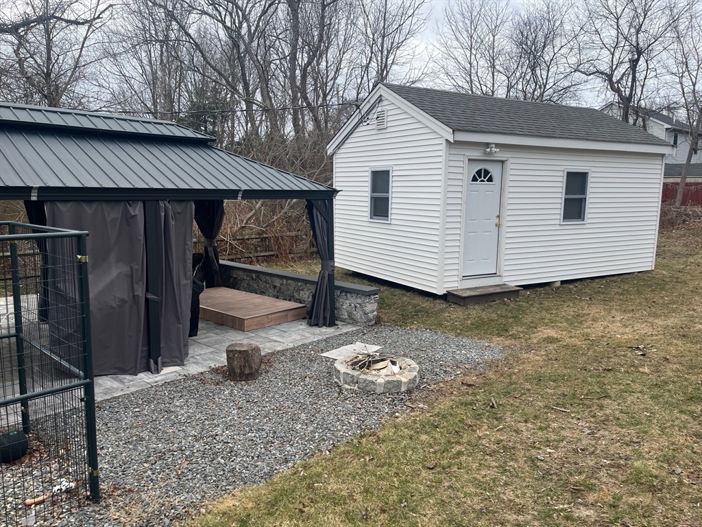 41 Jean Street Acushnet, MA 02743 - Photo 5 of 21 a front view of a house with a yard and garage