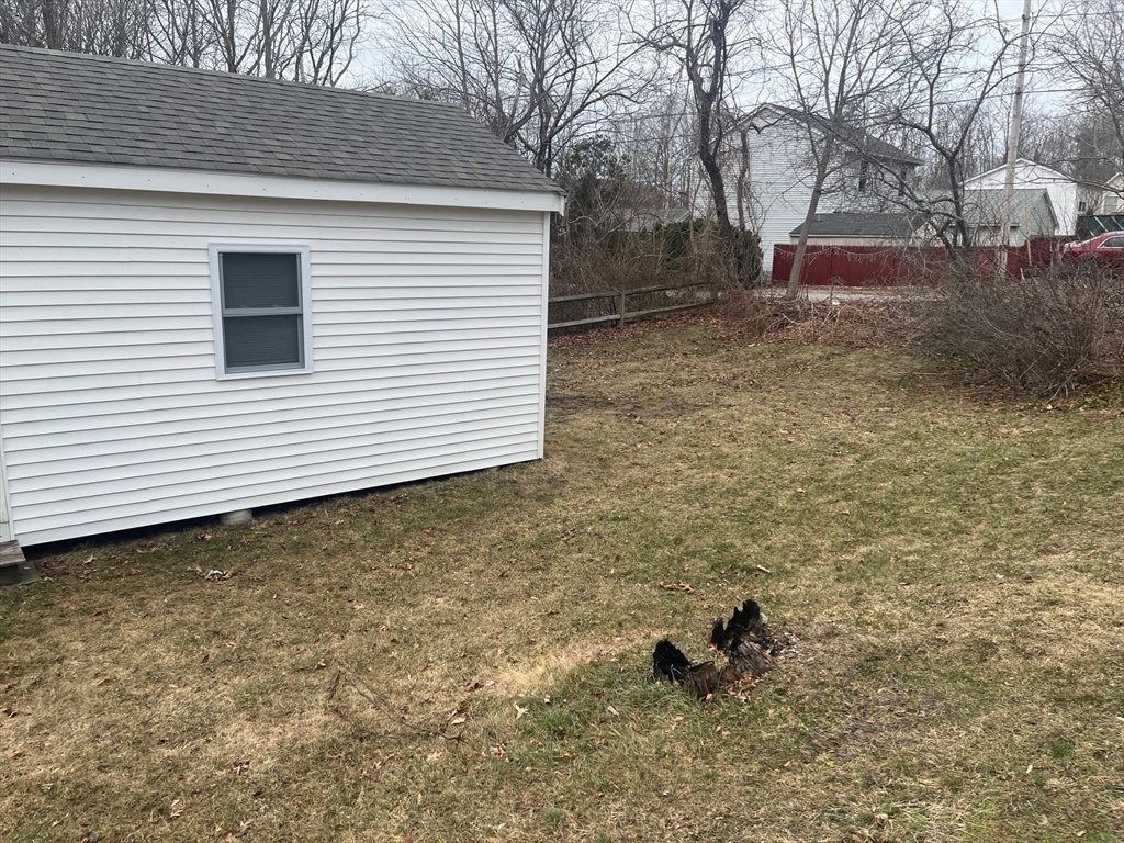 41 Jean Street Acushnet, MA 02743 - Photo 7 of 21 a backyard of a house with table and chairs