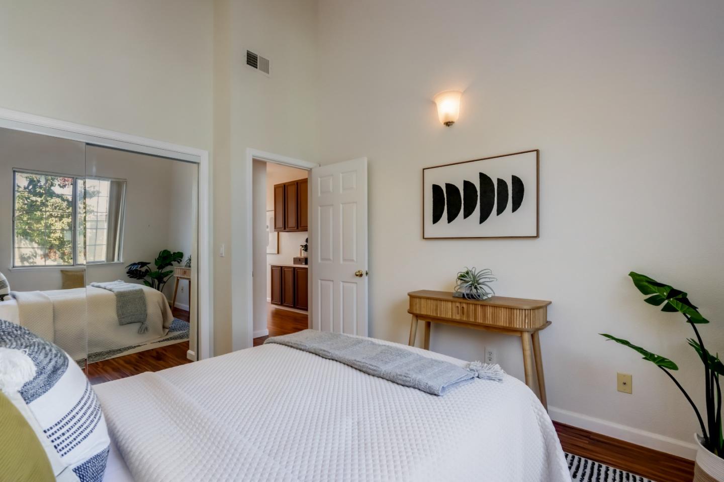 2373 Homestead Road Santa Clara, CA 95050 - Photo 17 of 30 a bedroom with a bed and wooden floor