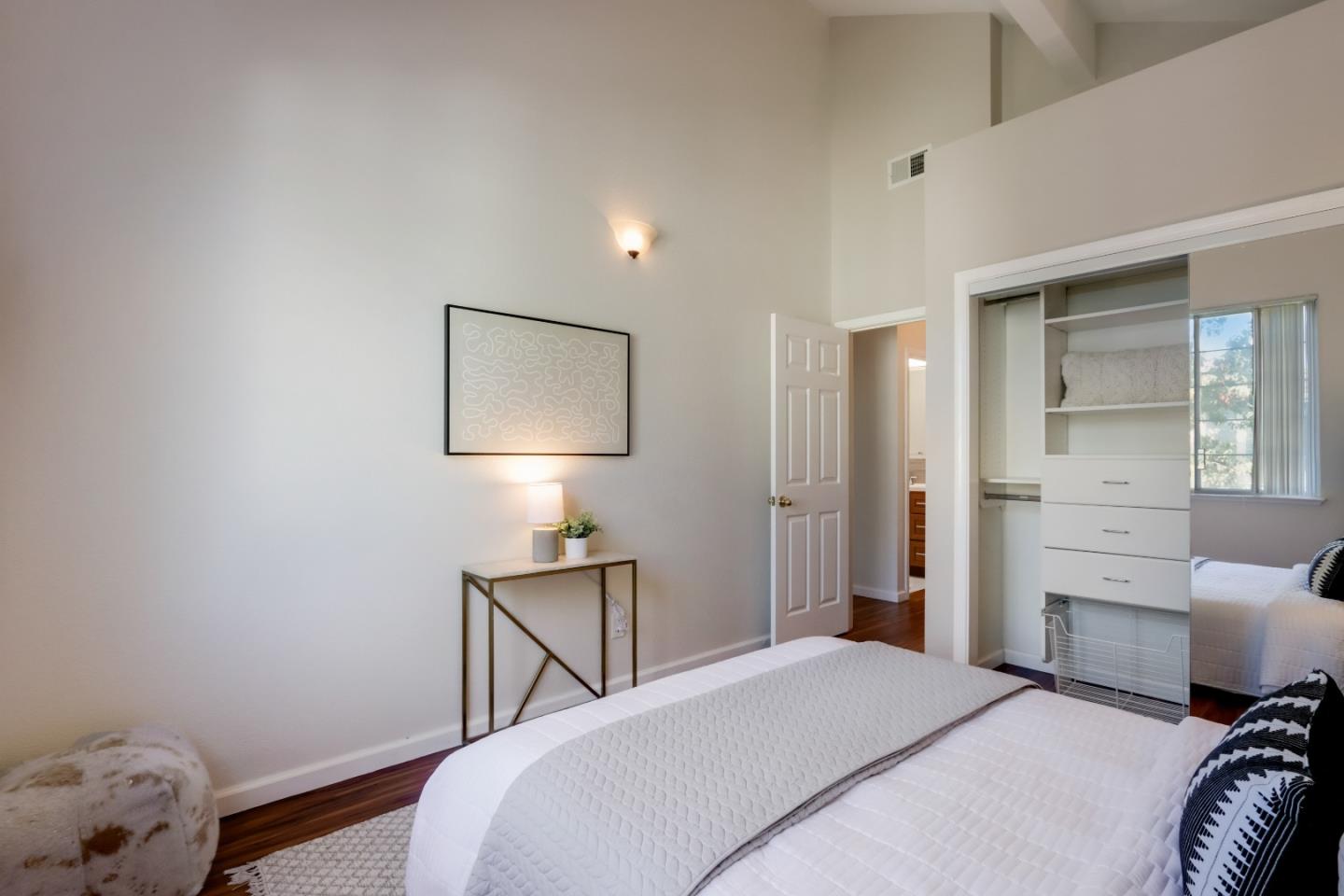 2373 Homestead Road Santa Clara, CA 95050 - Photo 19 of 30 a bedroom with a bed and a lamp
