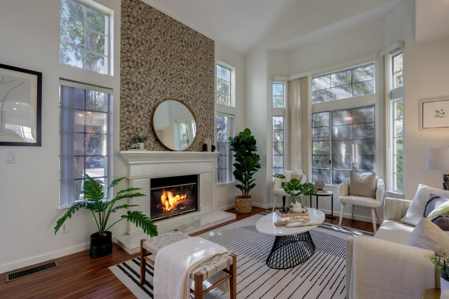 2373 Homestead Road Santa Clara, CA 95050 - Photo 2 of 30 a living room with furniture a fireplace and a potted plant